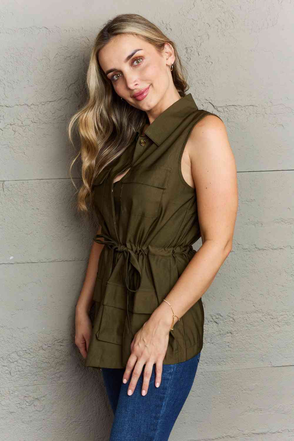 The Light Sleeveless Collared Button Down